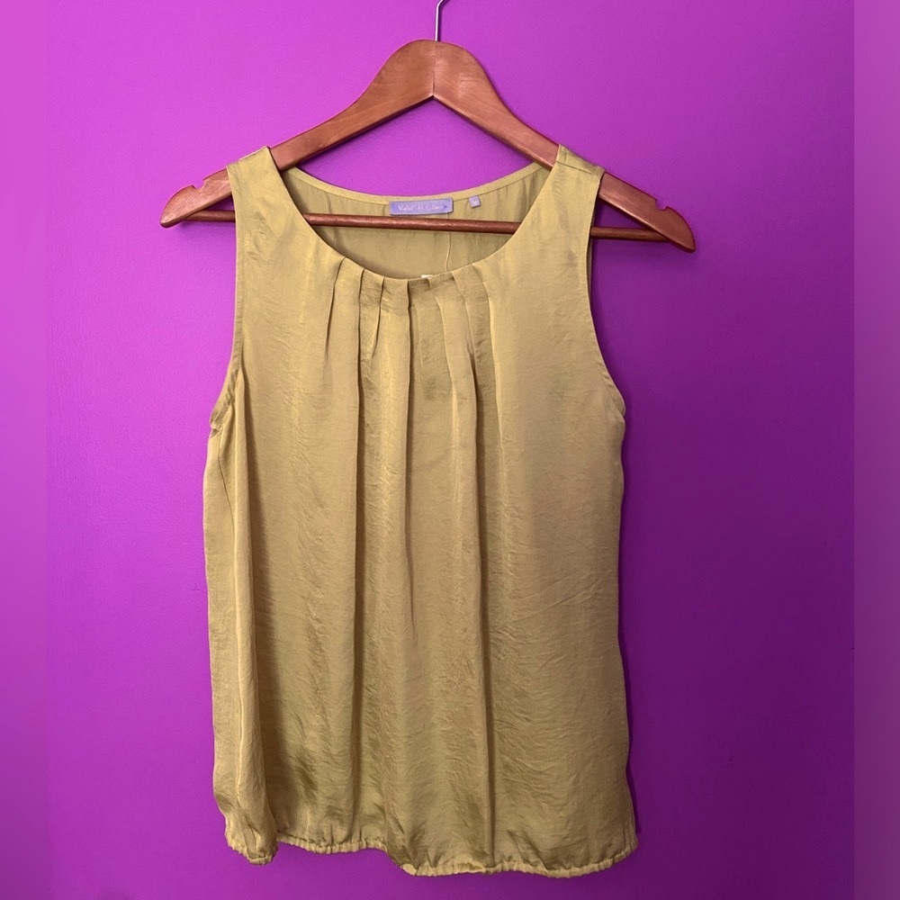NWT sleeveless blouse. Pretty yellow green color. Size medium